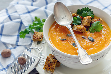 Image showing Spicy pumpkin soup in a porcelain bowl.