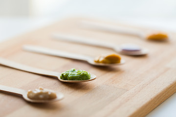 Image showing vegetable or fruit puree or baby food in spoons