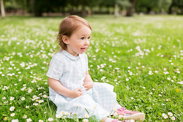 Image showing happy baby girl on green summer field