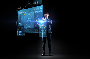 Image showing businessman in suit with virtual projection