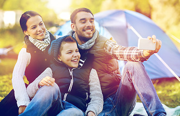 Image showing family with smartphone taking selfie at campsite