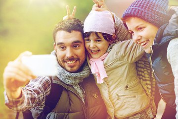 Image showing family taking selfie with smartphone in woods