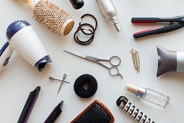 Image showing scissors, hairdryers, irons and brushes