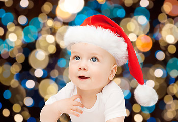 Image showing little baby boy in santa hat at christmas