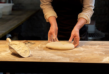 Image showing chef or baker cooking dough at bakery