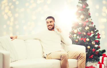 Image showing man calling on smartphone for christmas