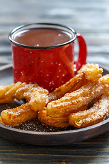 Image showing Traditional Spanish dish churros with chocolate.