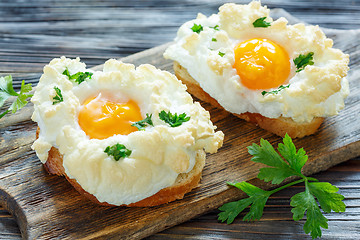 Image showing Bread with baked eggs Orsini.