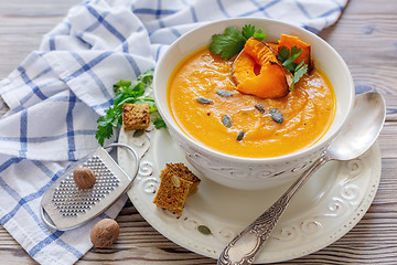 Image showing Spicy pumpkin soup with greens.