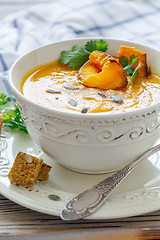 Image showing Pumpkin soup with chunks of baked pumpkin and spices.