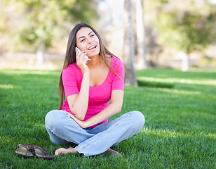 Image showing Beautiful Young Ethnic Woman Talking on Her Smartphone Outside.