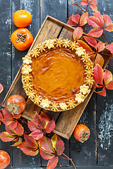 Image showing Homemade pumpkin pie on a wooden box.
