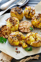 Image showing Potatoes baked in their skins with spices.