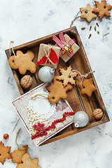 Image showing Christmas cookies,gifts,greeting card and silver balls.