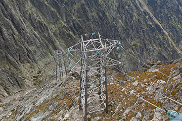 Image showing Electric power line in extremely high rocky mountains