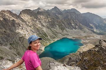 Image showing Hiking woman admiring the beauty of rocky Tatra mountains