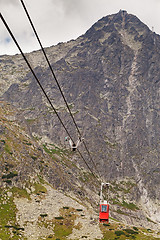 Image showing Wagon cable car against the background of beautiful rocky mountains