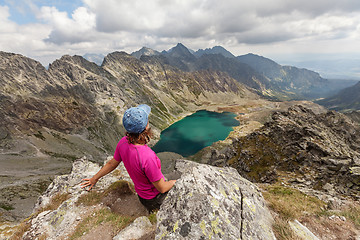 Image showing Hiking woman admiring the beauty of rocky Tatra mountains