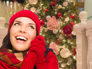 Image showing Warmly Dressed Female In Front of Decorated Christmas Tree.