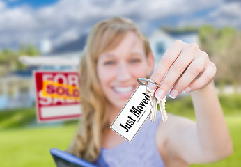 Image showing Woman Holding New House Keys with Just Moved Card In Front of So