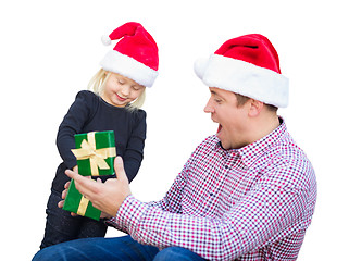 Image showing Happy Young Girl and Father Wearing Santa Hats Opening Gift Box 