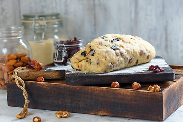Image showing Traditional Christmas Stollen on a floured board.