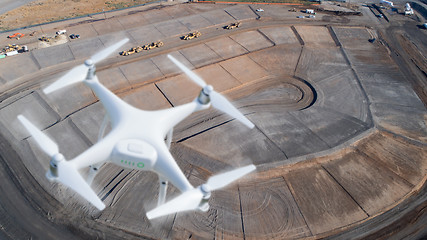 Image showing Unmanned Aircraft System (UAV) Quadcopter Drone In The Air Over 