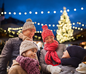 Image showing happy family outdoors at christmas eve