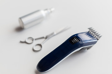Image showing styling hair spray, trimmer and scissors
