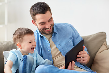 Image showing father and son with tablet pc playing at home