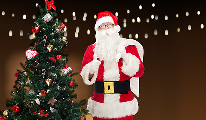 Image showing santa claus with bag and christmas tree