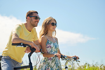 Image showing happy couple with bicycles at country