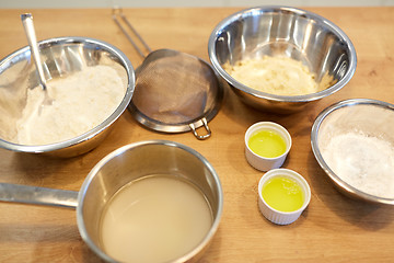 Image showing bowls with flour and egg whites at bakery kitchen