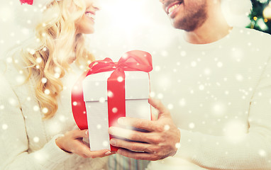 Image showing close up of couple with christmas gift at home