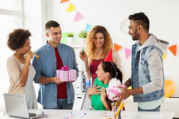 Image showing team greeting colleague at office birthday party