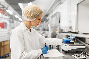 Image showing woman working at ice cream factory