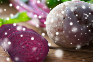 Image showing close up of sliced beet on wood