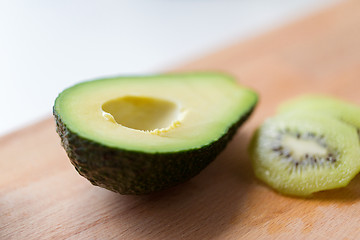 Image showing close up of avocado on wooden cutting board