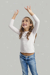 Image showing Girl playing with soap bubbles