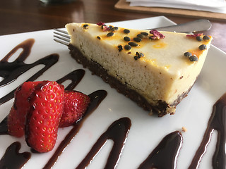 Image showing AIP Paleo Cashew Milk cheesecake on a plate in wellness cafe