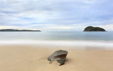 Image showing Three rock forms in a landscape