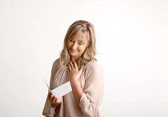 Image showing Woman reading a heartfelt message note or card