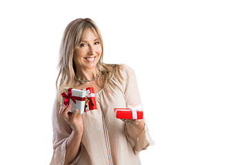 Image showing Female woman holding giving a bunch of wrapped gifts