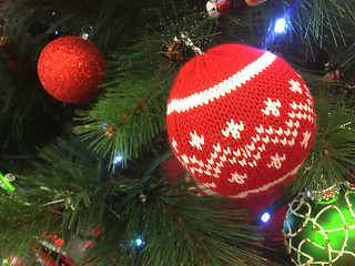 Image showing Christmas tree ornaments hanging on a tree