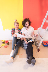 Image showing Happy young couple relaxing after painting