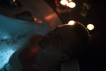 Image showing man relaxing in the jacuzzi