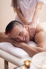 Image showing young man having a back massage