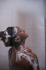 Image showing African American woman in the shower