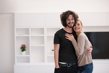 Image showing couple hugging in their new home