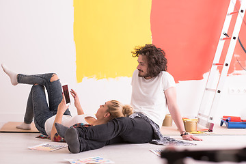 Image showing Happy young couple relaxing after painting